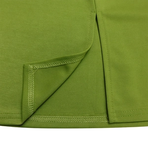 Detailed close-up of smooth green fabric featuring a precise slit and overlock stitching