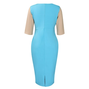 Rear view of bodycon midi dress featuring blue patchwork, back zipper, and hem slit detail