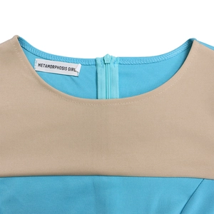 Detail of blue and beige patchwork crew neck with high-quality stitching and hidden back zipper