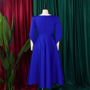 Back view of elegant royal blue midi dress with long sleeves and hidden zipper detail