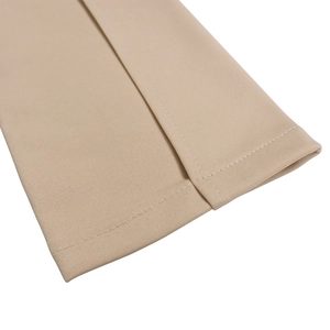 Detail of neatly stitched white seams on beige woven fabric for plus size dress