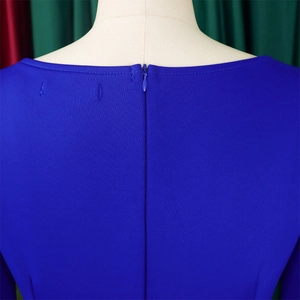 Detail of royal blue dress with seamless back zipper and fine knit fabric texture