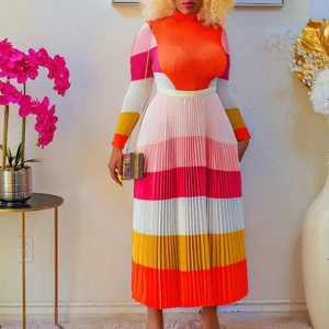 Detail of colorful striped pleated knit dress featuring high neck and long sleeves