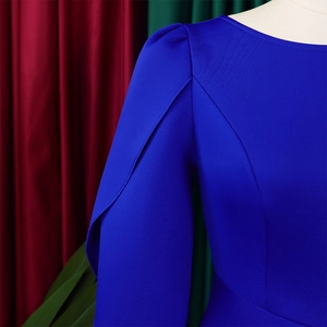 Detail of royal blue dress showing elegant layered pleats on the shoulder and neckline