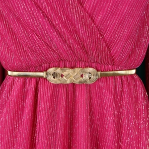 Detail of rose red pleated dress with golden lurex thread and infinity buckle belt