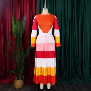 Detailed close-up of pleated maxi dress with vibrant multi-color block pattern design