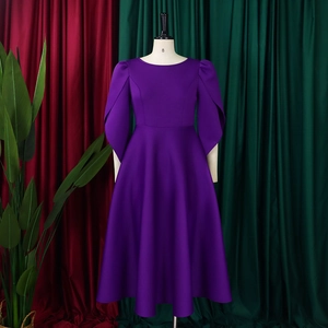 Detail of the purple A-line dress featuring flared slit sleeves and a fitted waistline