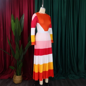 Detailed view of long sleeve pleated dress featuring bold multicolor patchwork design