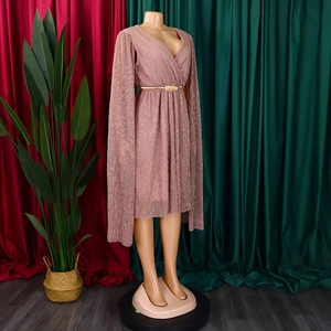 Detail of elegant V-neck cape dress in pink silk fabric with gold braided belt