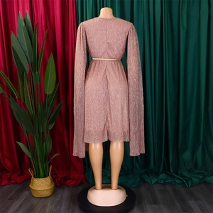 Detail view of pink shimmer gown featuring a matching gold belt and elegant cape-style sleeves