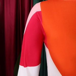 Detail of breathable mesh fabric featuring a vibrant geometric color-block pattern