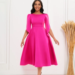 Detail of rose pink dress featuring dramatic bell sleeves and an elegant A-line silhouette