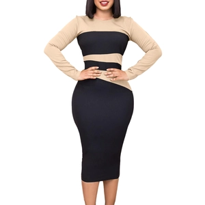 Dettaglio elegante vestito midi patchwork color-block con maniche lunghe slim fit per donna