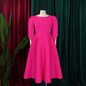 Detail of rose red A-line dress featuring elegant puff sleeves and a cinched waist