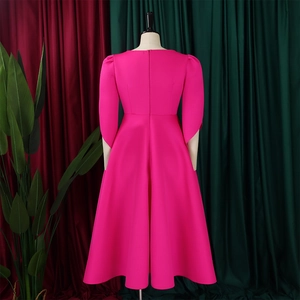Detailed back view of a rose pink midi dress with flared skirt and invisible back zipper