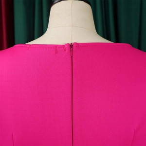 Close-up of the invisible back zipper and stitching on this magenta boat neck dress