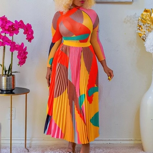 Detail of vibrant geometric print pleated maxi dress with long sleeves and high neck