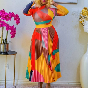 Detail of colorful geometric print pleated skirt set with high neck and long sleeves