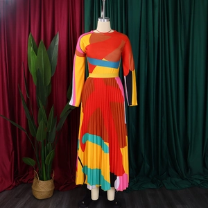 Detail of colorful geometric print and pleated texture on women's long sleeve midi dress