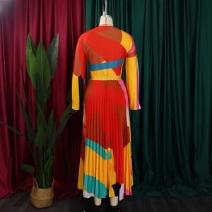 Detailed back view of pleated dress with vibrant geometric abstract colorful patterns