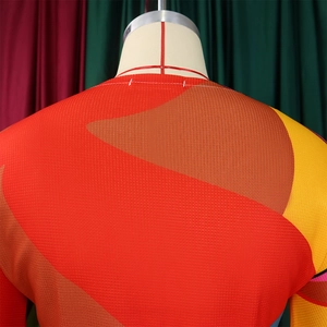 Close-up of vibrant geometric print fabric with breathable mesh texture on women's set