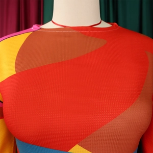 Close-up of crew neck and colorful geometric pleated print on elastic high-stretch fabric