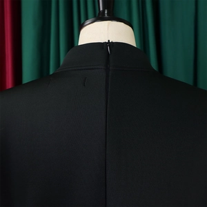 Detail view of the high-waist black dress featuring a seamless back invisible zipper