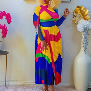 Detail of colorful pleated skirt set showing vibrant color-block fabric and vertical pleats