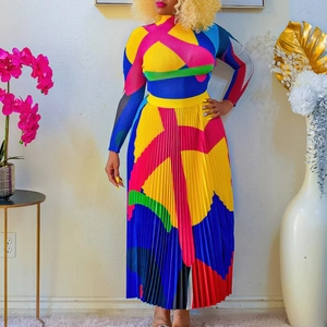 Detailed view of the vibrant geometric print fabric and elegant pleated texture on the skirt