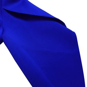 Macro shot of fine stitching and royal blue smooth fabric on elegant African dress