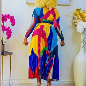 Rear view of long sleeve pleated maxi dress with bold colorful geometric colorblock patterns