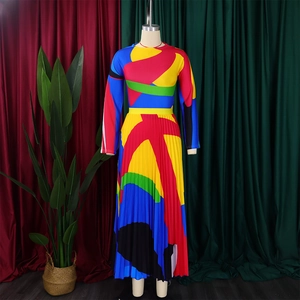 Detailed view of bold geometric color-block pleats on a long-sleeved midi dress
