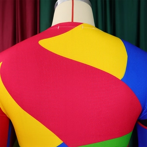 Detailed macro view of professional breathable mesh fabric with vibrant color-block stitching