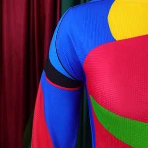 Close-up of pleated vibrant color block fabric with detailed honeycomb texture and stitching