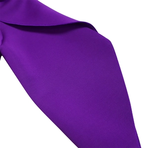 Detailed close-up of dark purple fabric featuring high-quality hemmed edges and stitching
