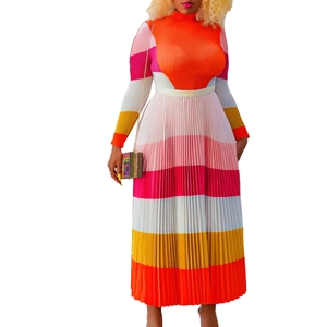 Detailed close-up of pleated texture on a colorful striped high-waist maxi skirt