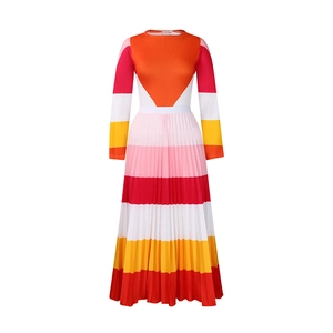 Detail of colorful pleated two-piece set featuring long sleeves and vibrant striped patterns