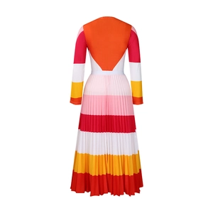 Detail of the pleated hem and colorful geometric stripe pattern on the long sleeve dress
