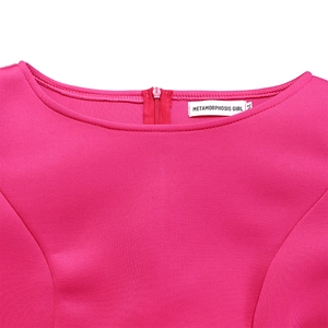 Detail of rose red dress neckline with invisible zipper and brand label on fabric