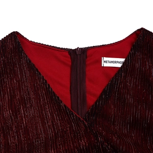 Close-up of elegant V-neckline and hidden zipper on dark red shimmering pleated dress
