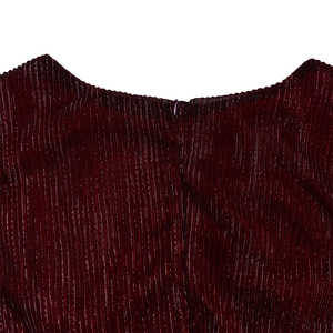 Detail of elegant pleated burgundy dress showing seamless back zipper and fine texture