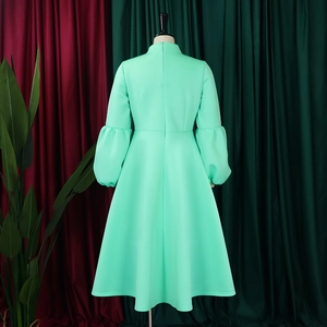 Detail of mint green puff sleeve maxi dress back with concealed zipper closure