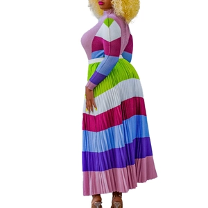 Detail of vibrant pleated two-piece set featuring colorful patterns and fine fabric textures