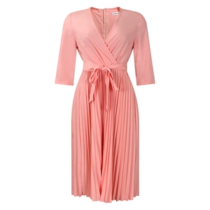 Detail of pink pleated V-neck dress featuring a wrap style waist and self-tie belt