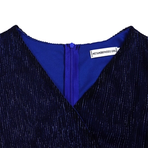 Detail of V-neckline and back zipper on dark blue pleated dress with metallic sheen