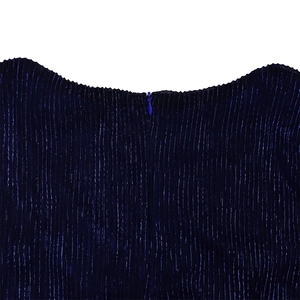 Detailed view of dark blue pleated fabric with invisible zipper and smooth neckline finish