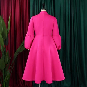 Detail of hot pink dress back with puff sleeves, A-line skirt and invisible zipper