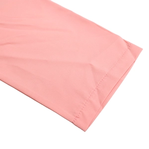 Detail of double-needle stitching on smooth pink long-sleeve dress fabric texture