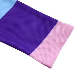 Macro detail of the tricolor pleated sleeve cuff featuring high-quality twin-needle stitching