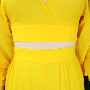 Detailed close-up of yellow chiffon lantern sleeves and pleated wide-leg pants set